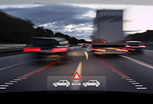 Blurred view of car windshield with digital warning sign indicating vehicle is too close to vehicles in front.
