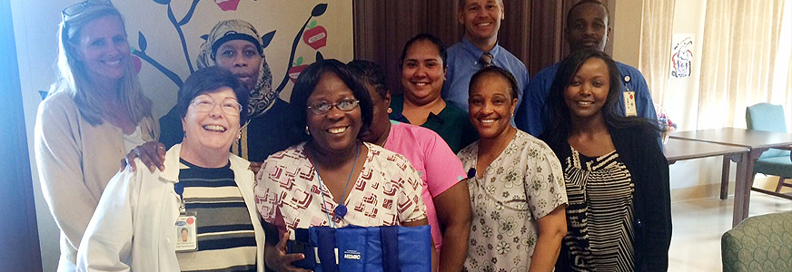 Gilpin Hall staff with Safe Assist Belt. Mike Havel is in background.