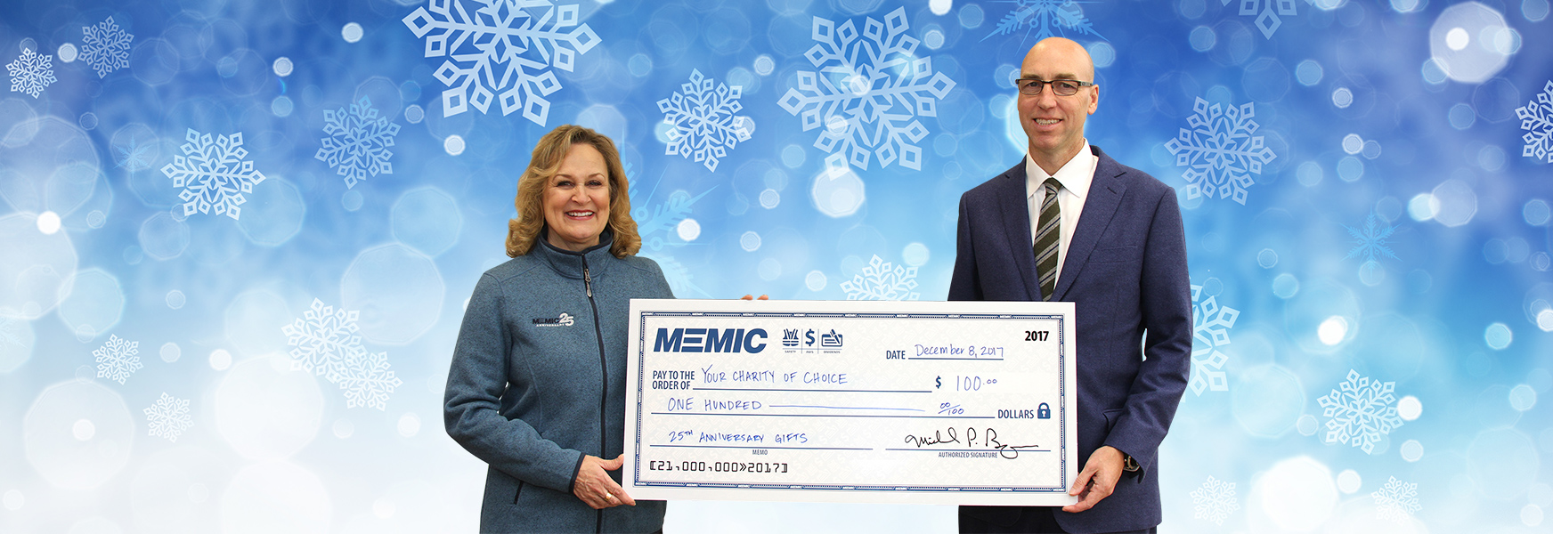 Catherine Lamson and Mike Bourque with big check