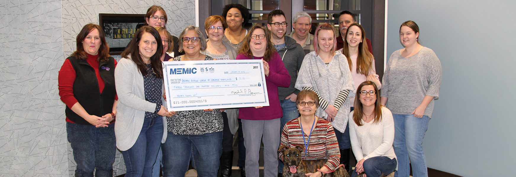 MEMIC employees give Animal Refuge League of Greater Portland a donation