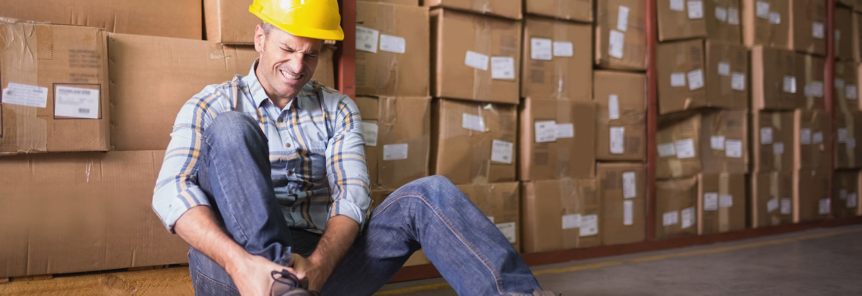 Injured worker in warehouse