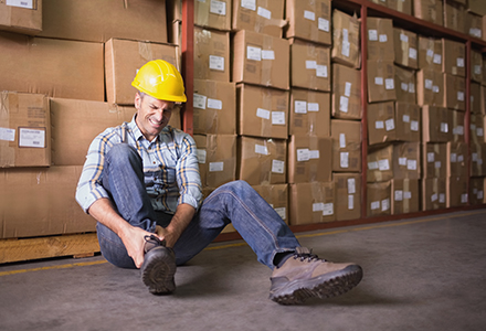 Injured worker in warehouse