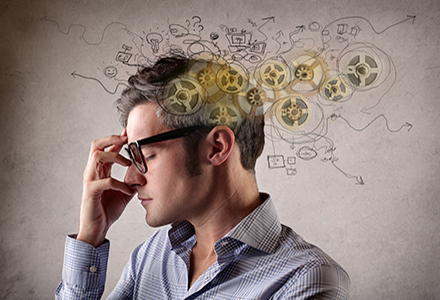 Man thinking with cogs and scribbled notes surrounding head