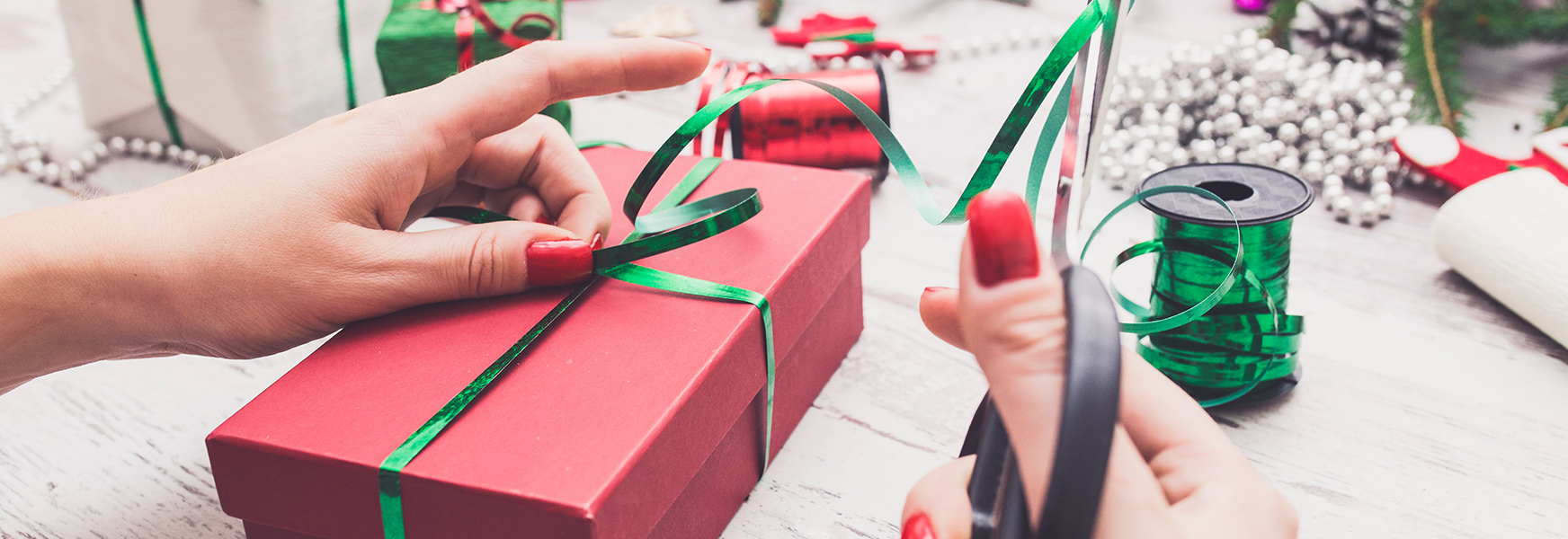 woman wrapping holiday presents