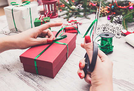 woman wrapping holiday presents