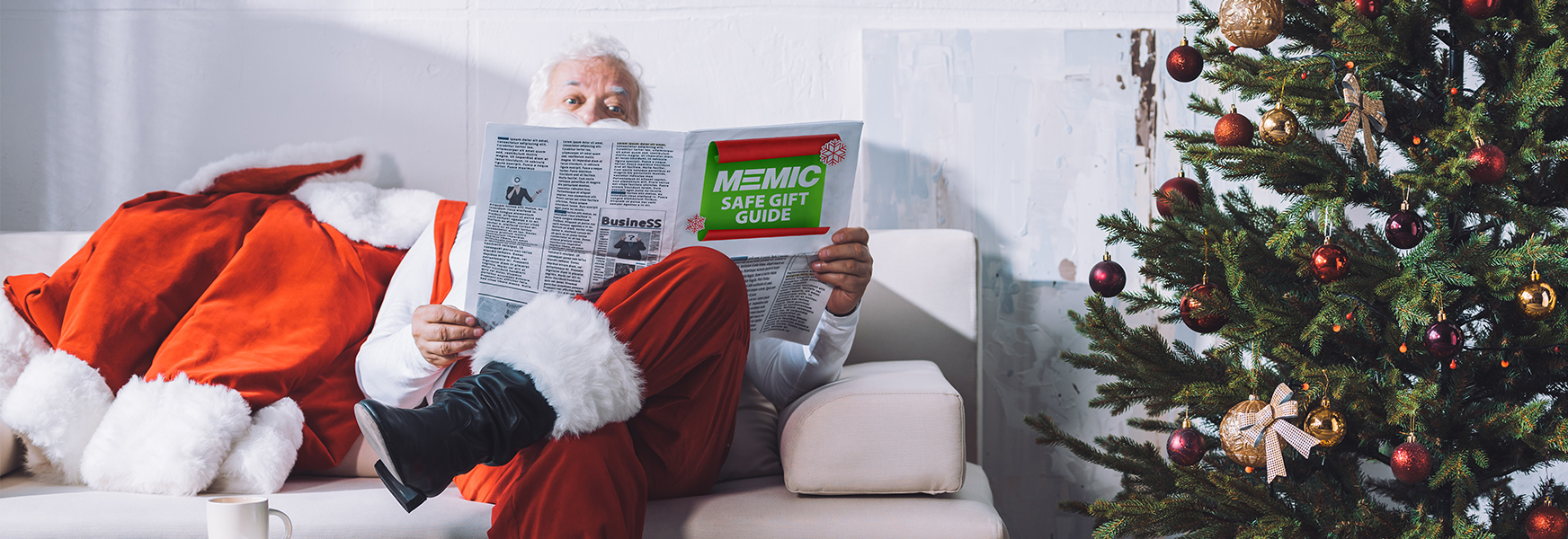 Santa Claus reading MEMIC Safe Gift Guide