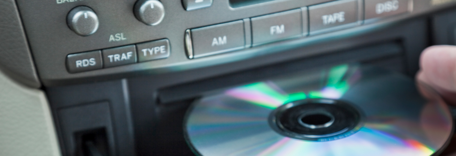 Music CD being loaded into CD player