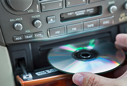 Music CD being loaded into CD player