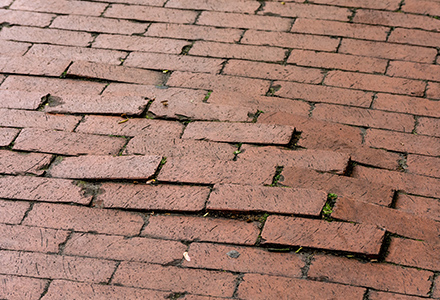 uneven brick pavement