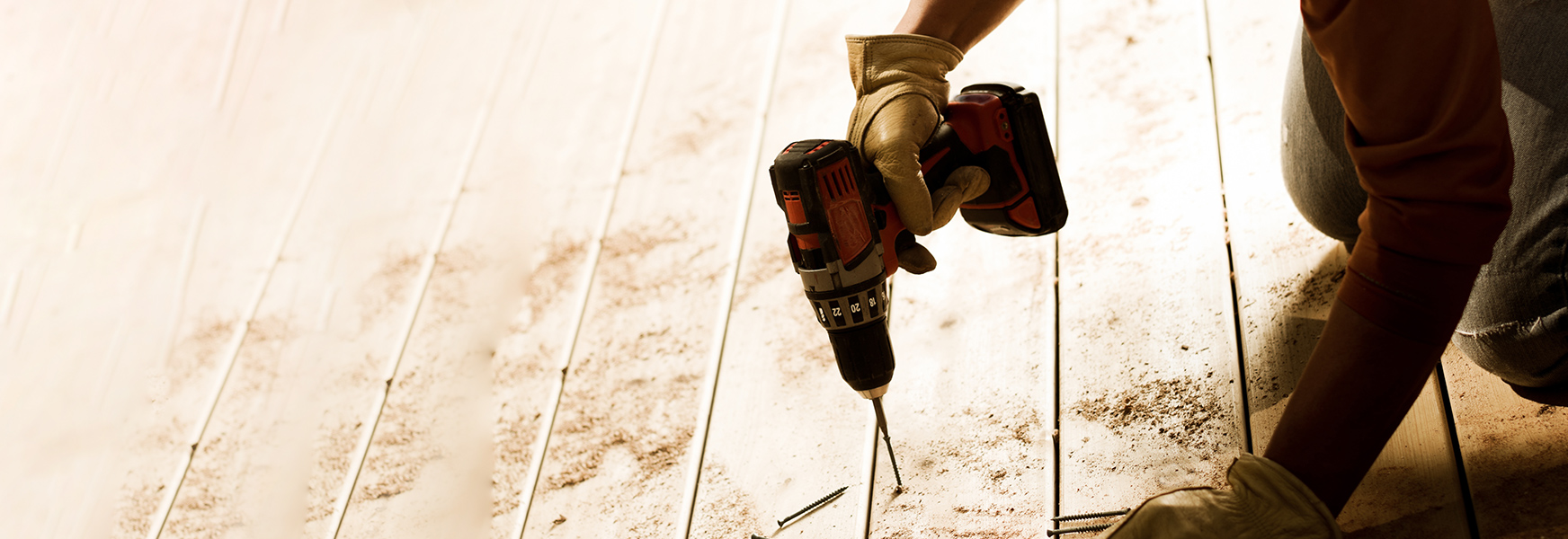 Worker using power drill