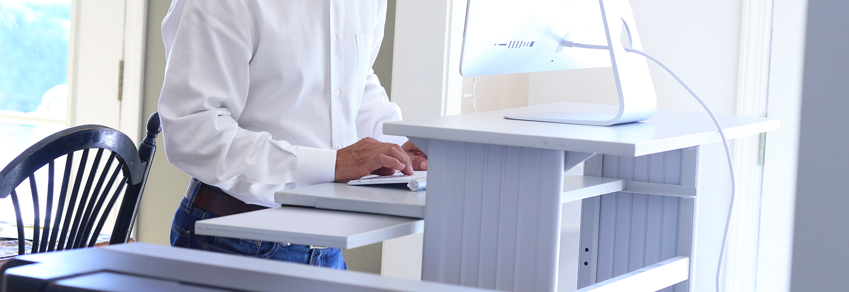 Man at fixed height desk