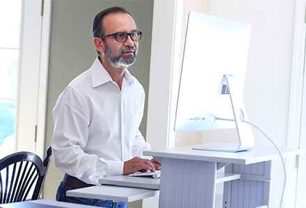 Man at fixed height desk