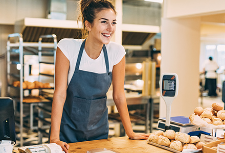 Young Girl Working At Bakery