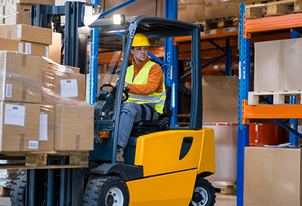 Worker Operating a Forklift