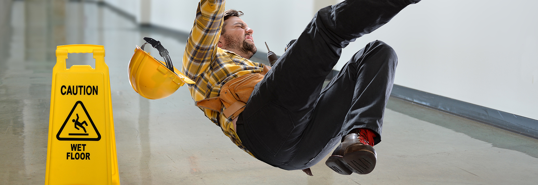 Worker slipping on wet floor