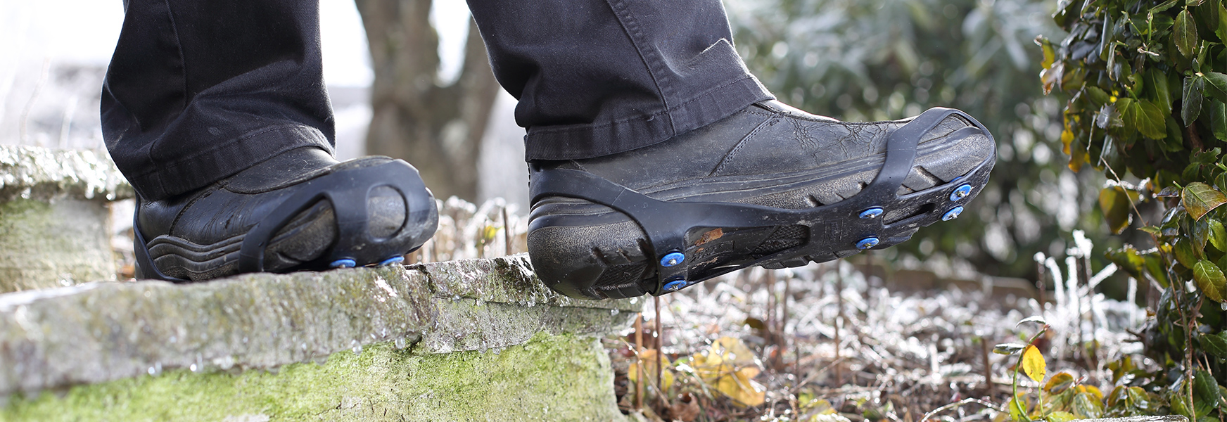 Boots equipped with traction enhancers.