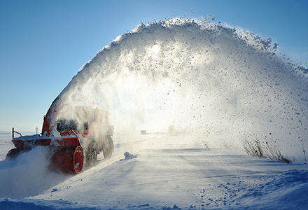 Snow machine removing snow