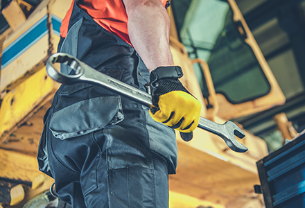 Maintenance worker holding wrench