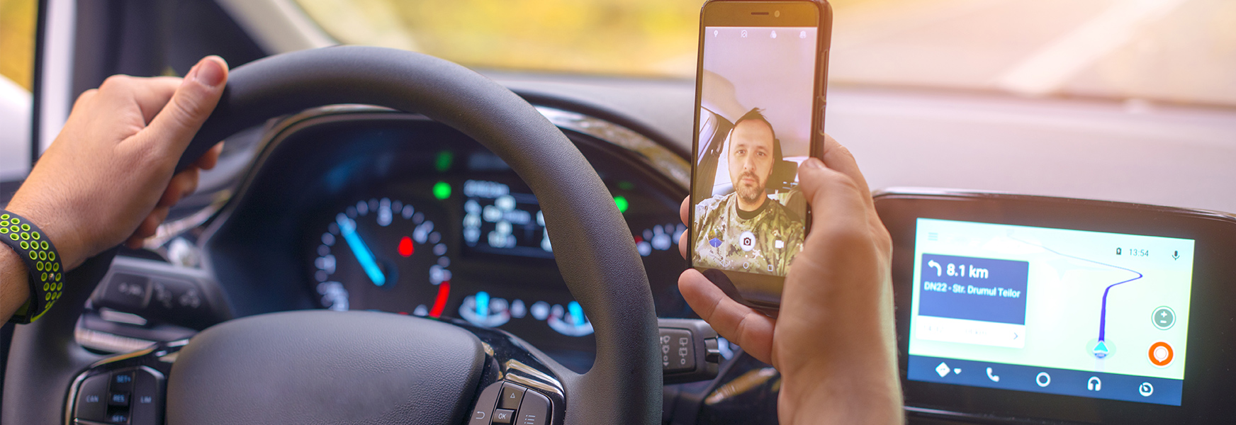 Distracted driver using cellphone to pictures of himself