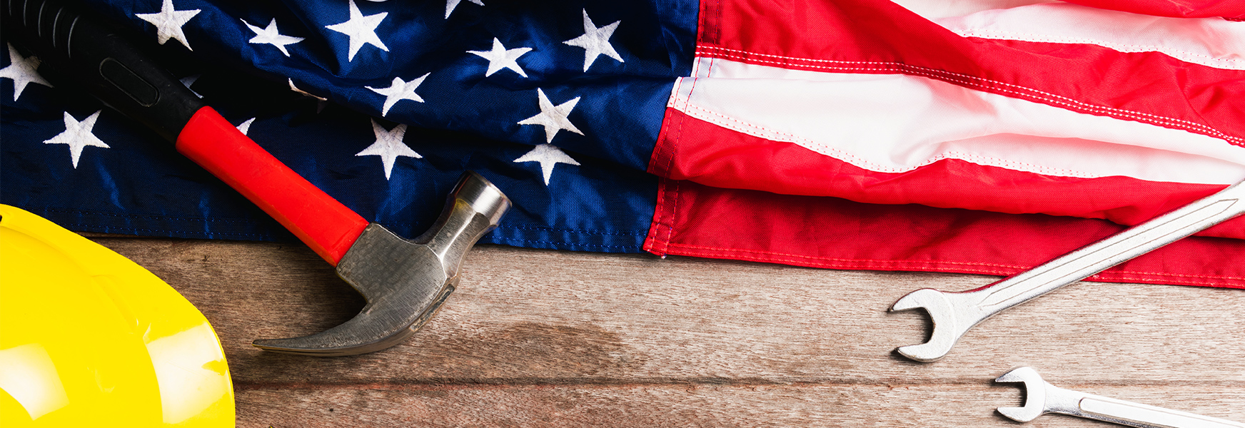 Hardhat and tools on American flag