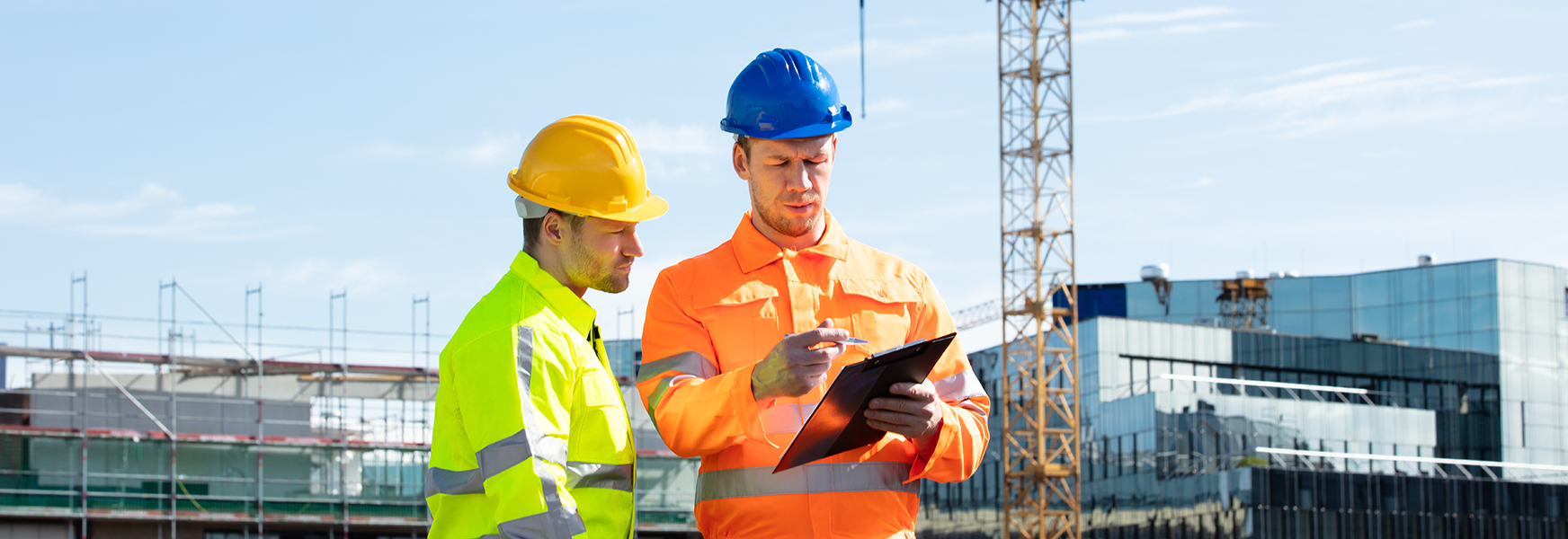 Construction workers assessing site