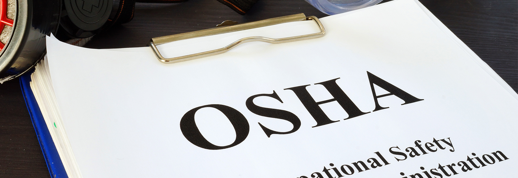 OSHA forms in a binder.