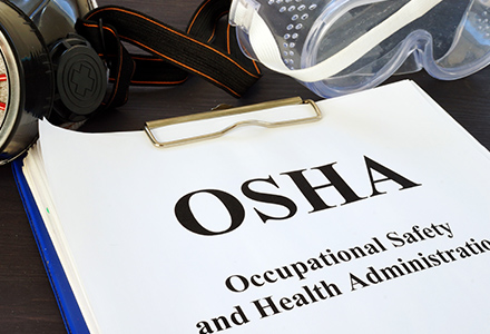OSHA forms in a binder.
