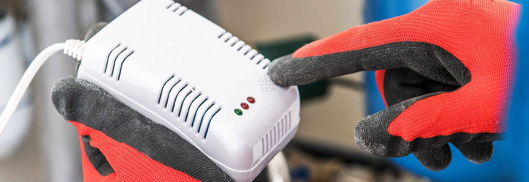 Technician Installing Carbon Monoxide Detector