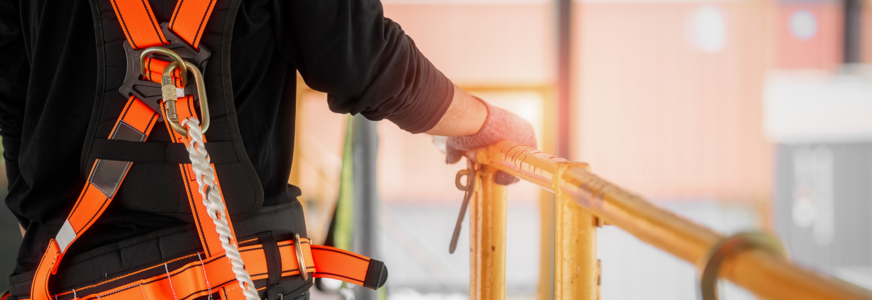 Construction worker wearing safety harness