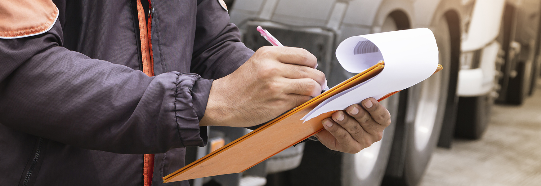 Worker writing on clipboard