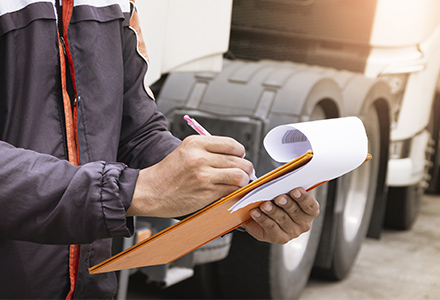 Worker writing on clipboard