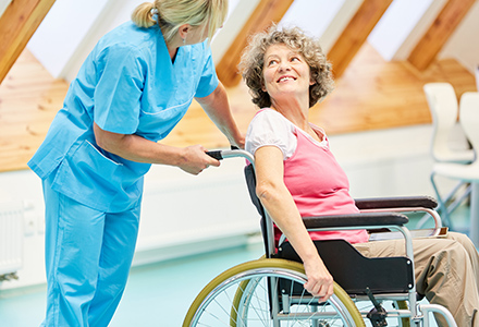 Nurse assisting patient in wheelchair