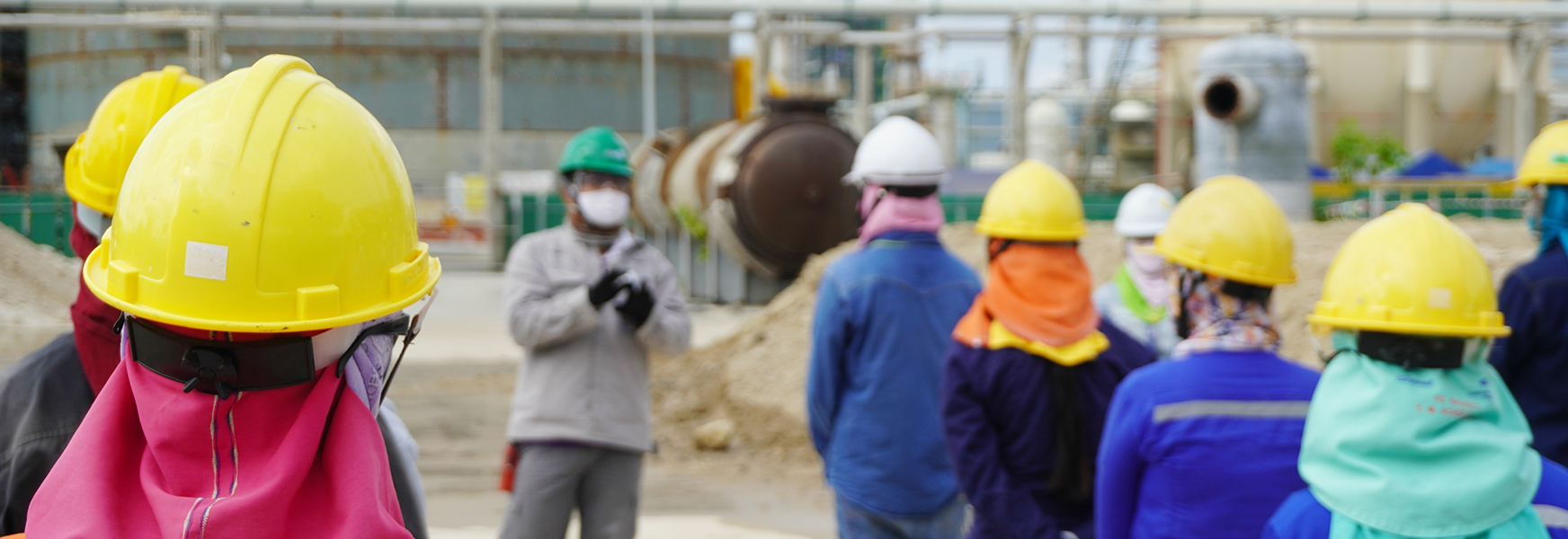 Workers attending morning safety meeting at job site