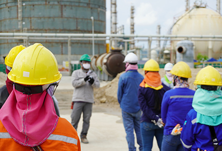 Workers attending morning safety meeting at job site