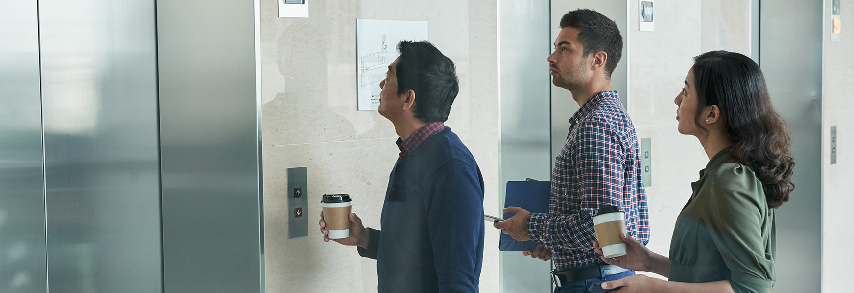 Office workers waiting for elevator