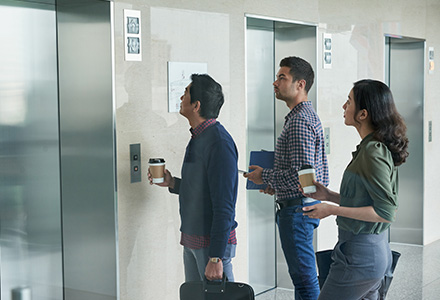 Office workers waiting for elevator