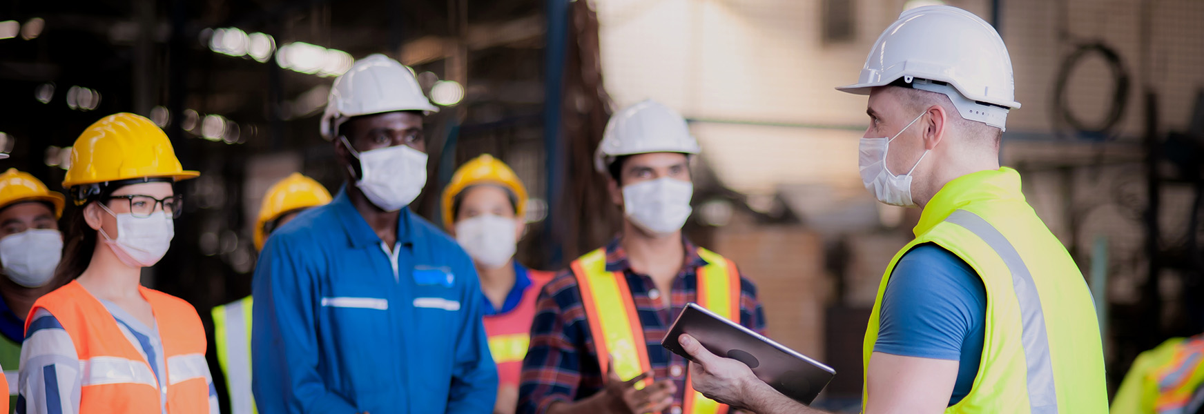 Factory workers having a daily safety meeting