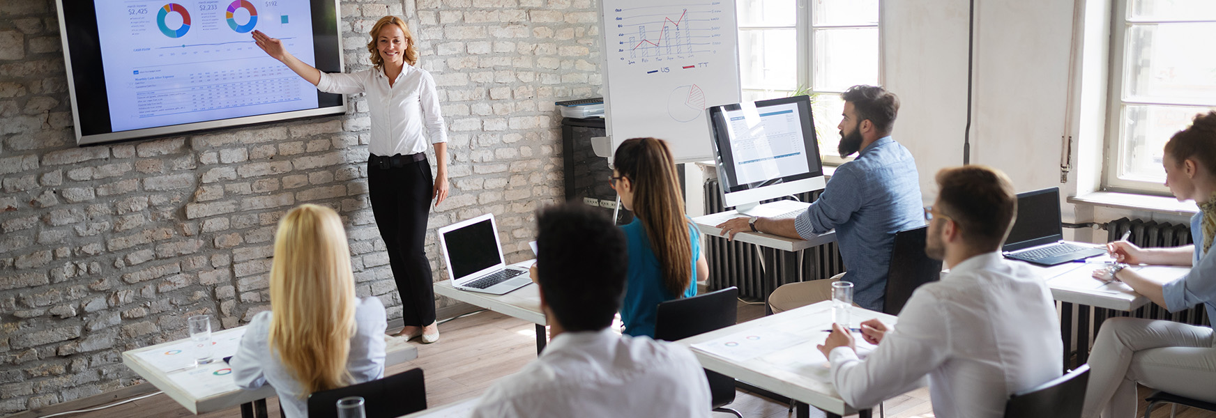 Employees in office training room