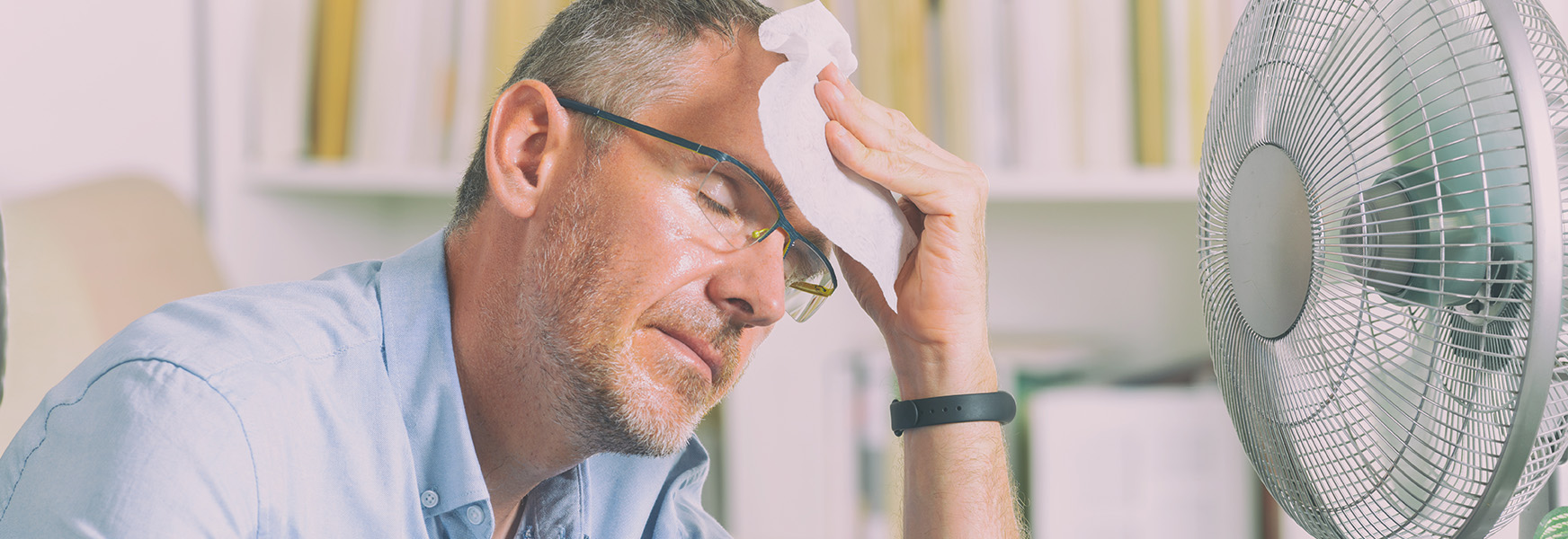 Office worker struggling with warm weather