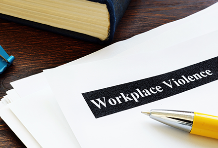 Workplace violence papers and forms on an office desk