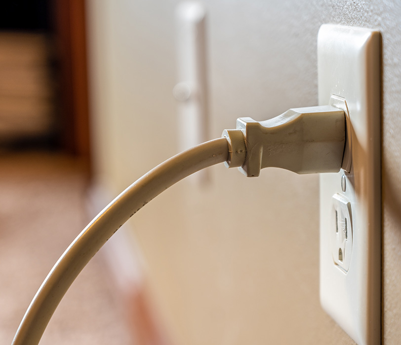 Cord plugged into electrical outlet