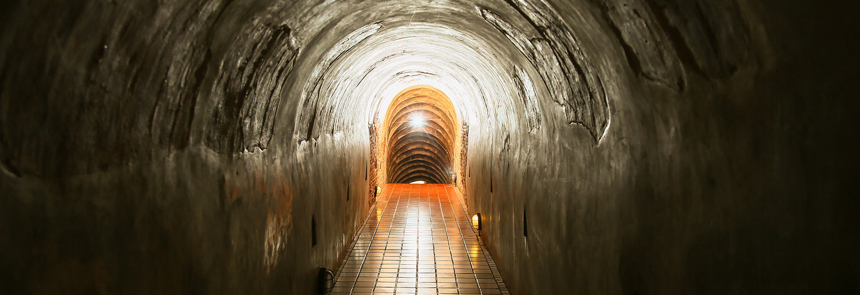 Confined space of a dimly lit underground tunnel