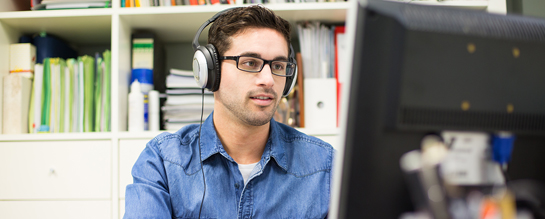 man at computer streaming training videos